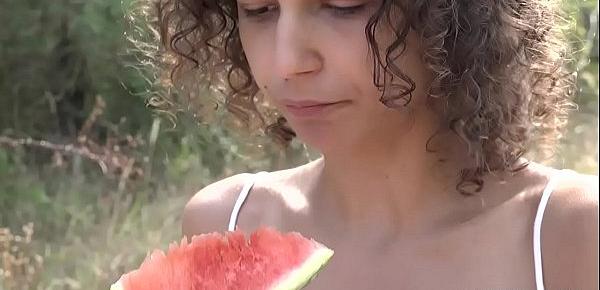  Curly hair teen loves watermelon and fucking on the grass
